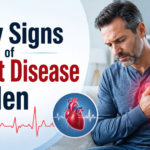 Middle-aged man experiencing chest discomfort with a heart illustration, highlighting early signs of heart disease in men.